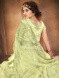 Myra Pista Green Heavy Embroidered Net Lehenga For Sale