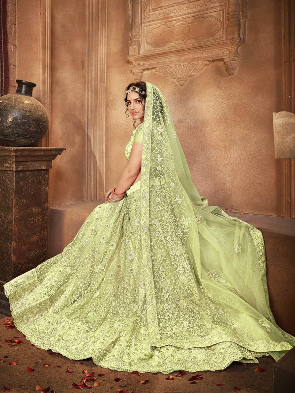 Myra Pista Green Heavy Embroidered Net Lehenga For Sale